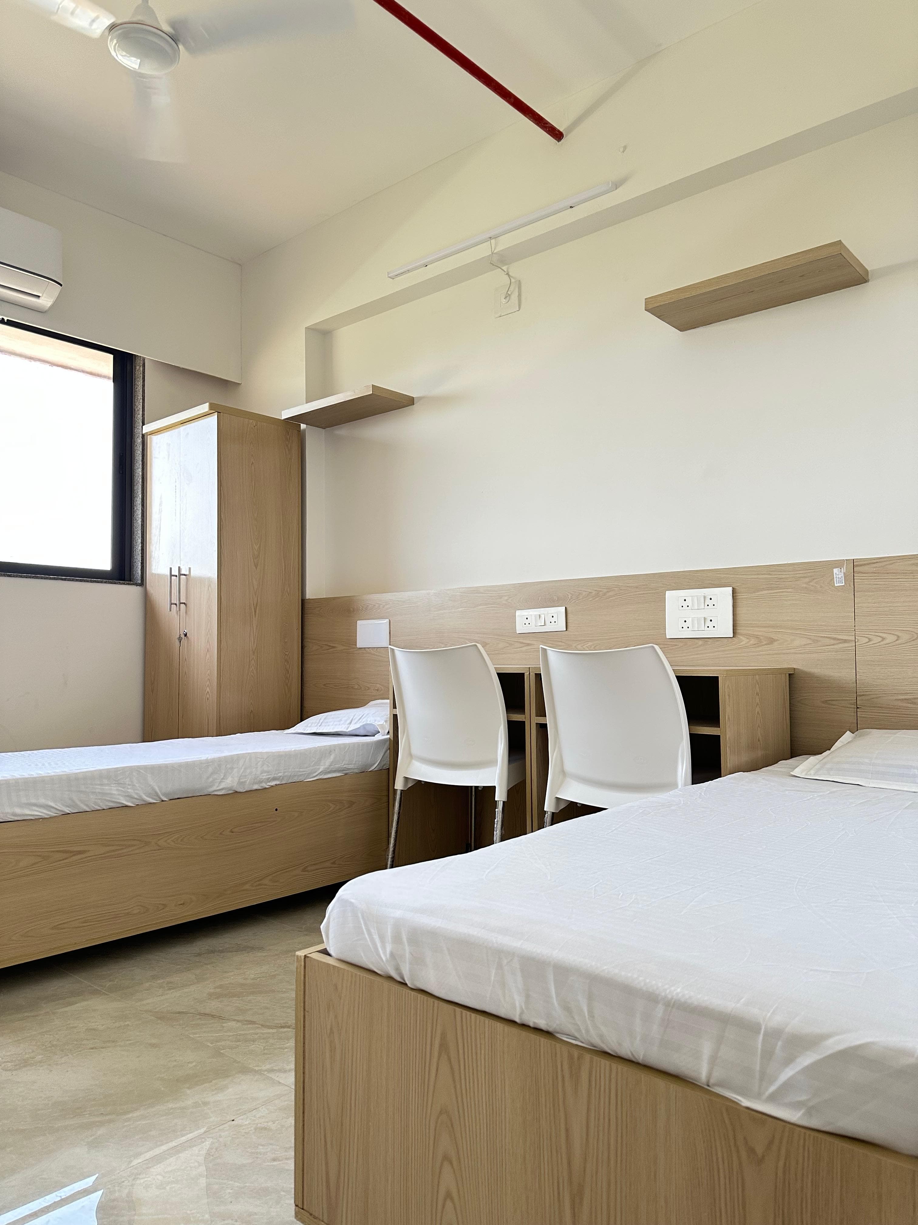 Triple Room at Unoloft PG in Ahmedabad with AC and study setup