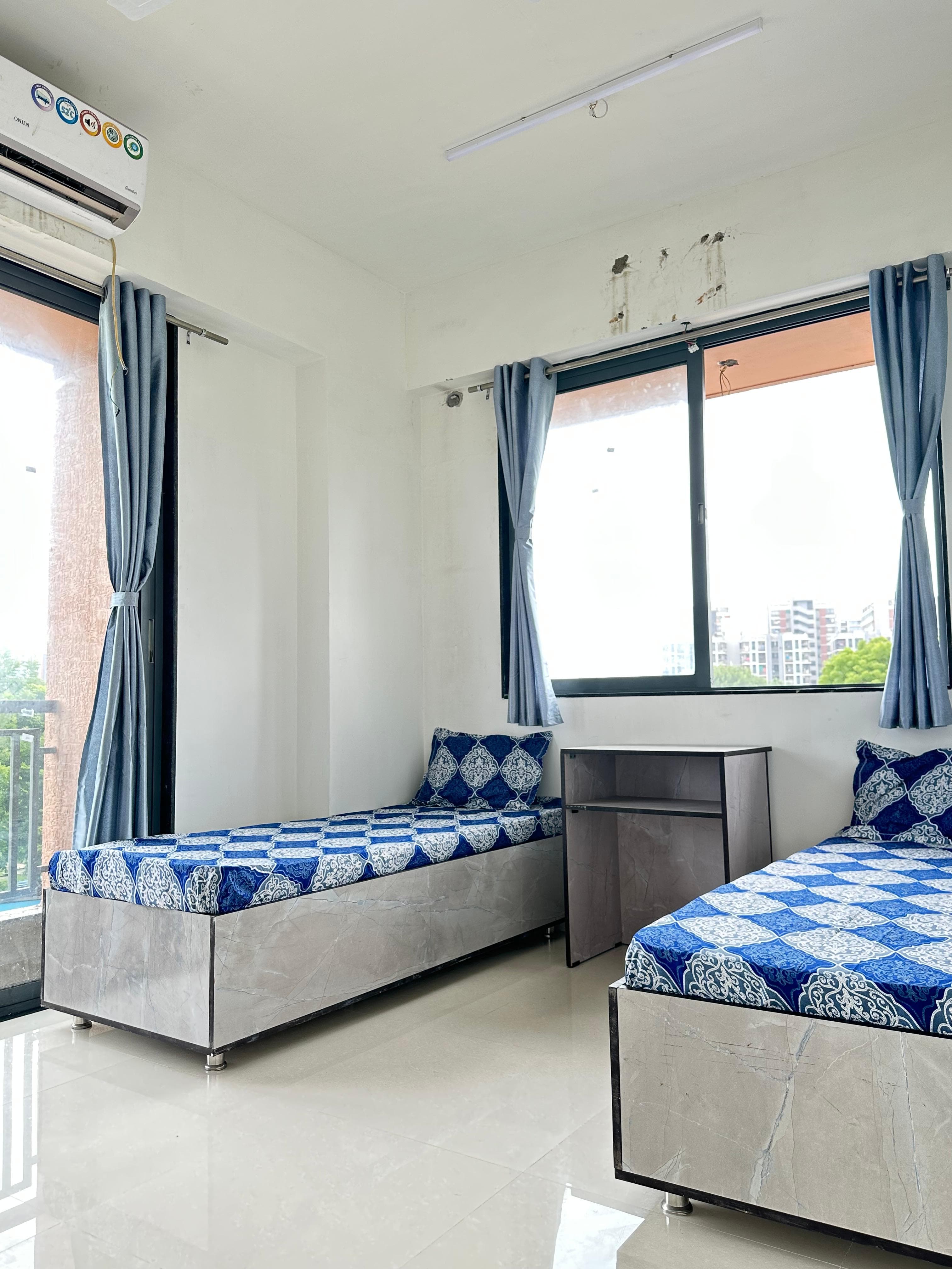 Aster Room 4 at Unoloft PG near Nirma University Ahmedabad